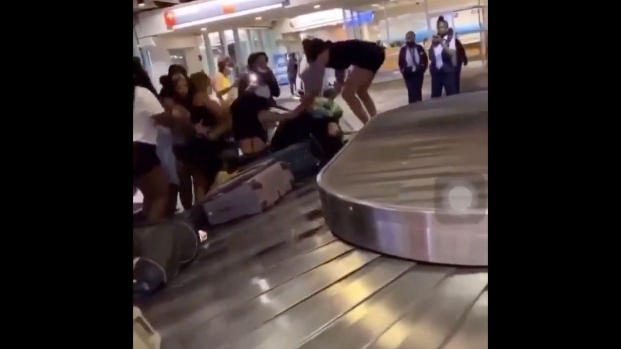 Viral video captures vicious mob brutally beating couple at airport while security stands by filming