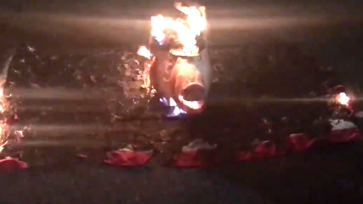 Rioters leave grisly threat for police outside Portland Justice Center: a burned, decapitated pig's head with a police hat