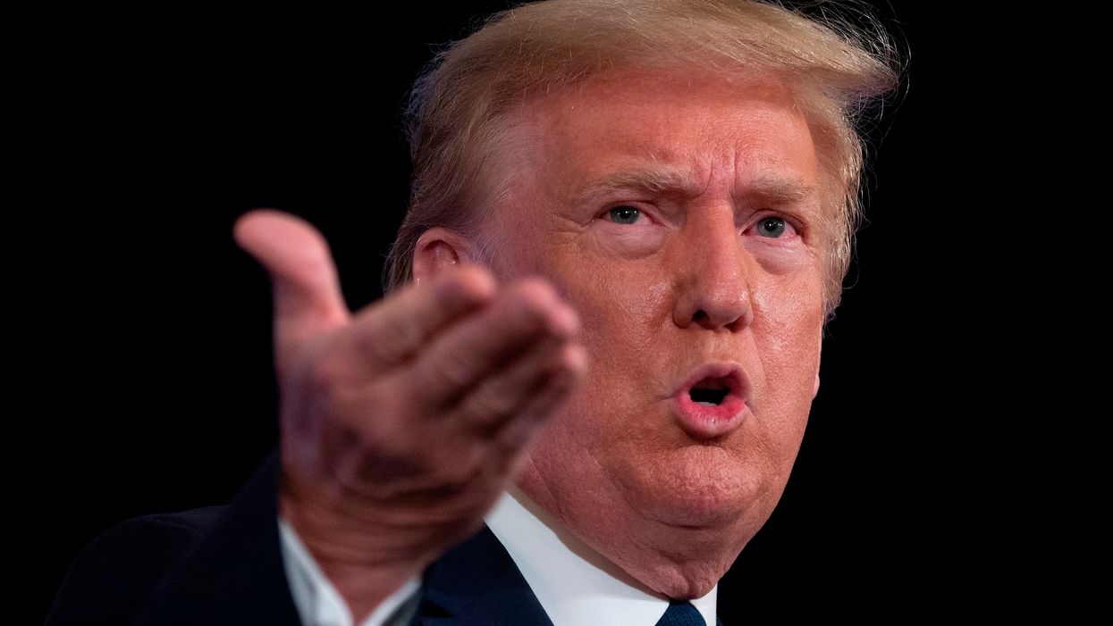 'It's a peaceful protest' Trump tells reporter who accused unmasked supporters of breaking the law