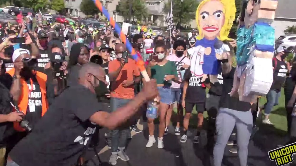 Black Lives Matter protesters intimidate police union leader at his house by beating effigy of his journalist wife with a bat