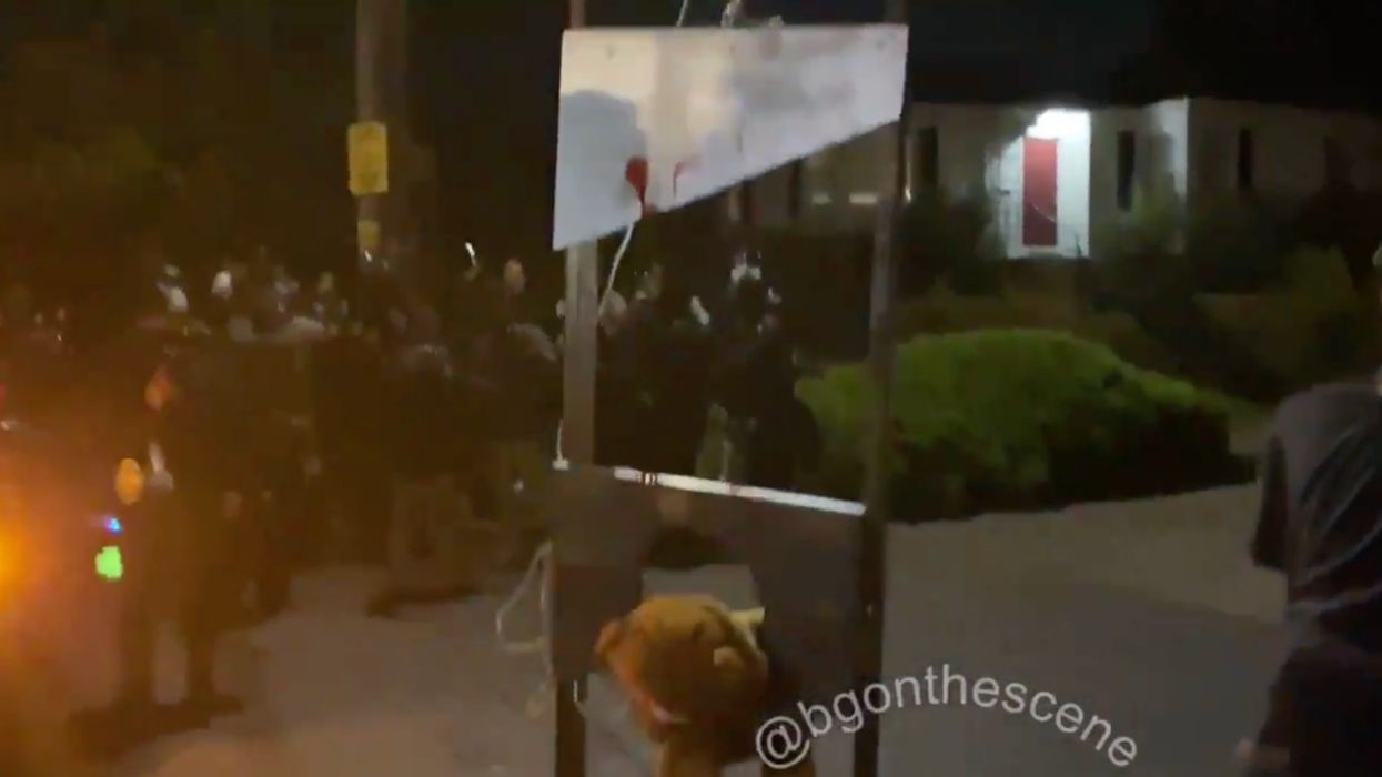 Rioters calling themselves heroes take to Portland's streets with 'bloody' guillotine, flaming American flags: 'Get in the f***ing streets!'