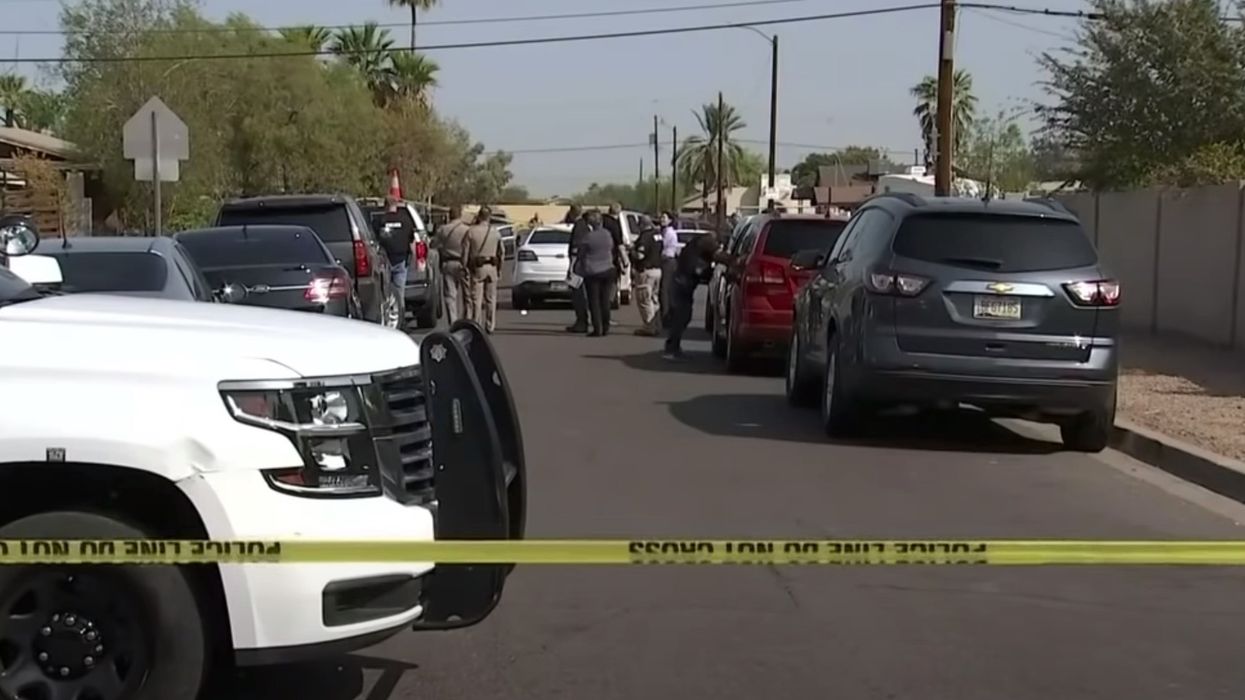Car pulls up to troopers and teen passenger shoots at them in Phoenix ambush; one arrested, police on manhunt for driver