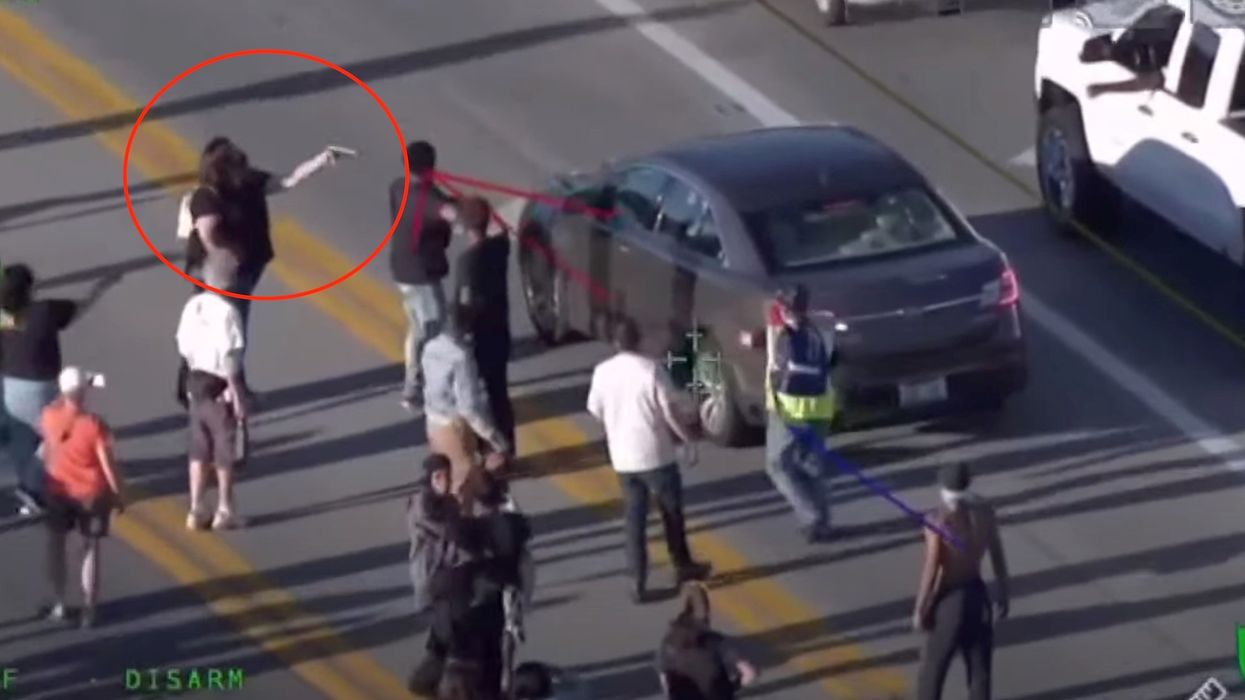 Man loses his job after pulling a gun on protesters in Louisville. Police posted video showing a protester pointing a gun at him.