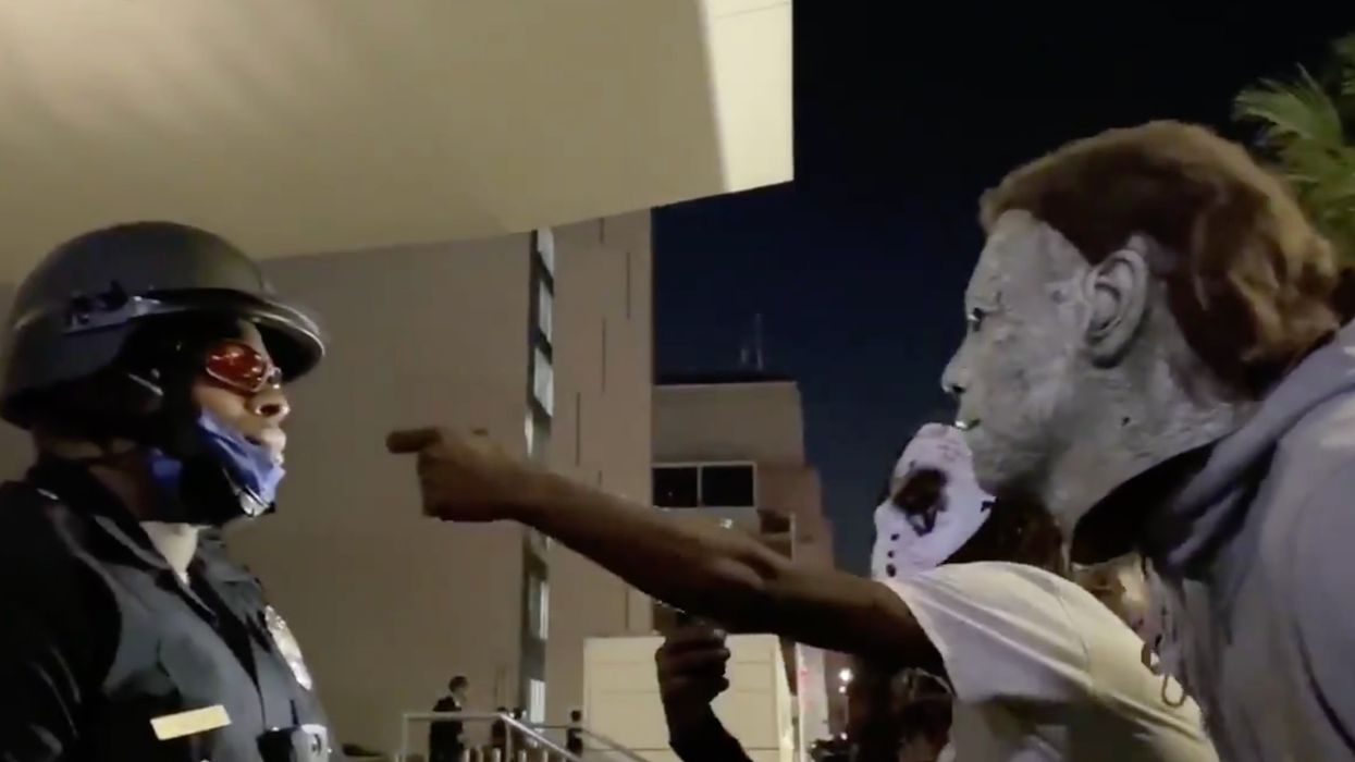 Rioters scream racial slurs at black police officer during Breonna Taylor protests. His stoic response is everything.