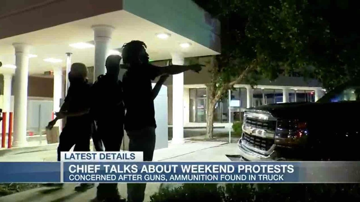 Police get rid of protesters surrounding pickup truck — then arrest driver, passenger when guns, weapons found inside