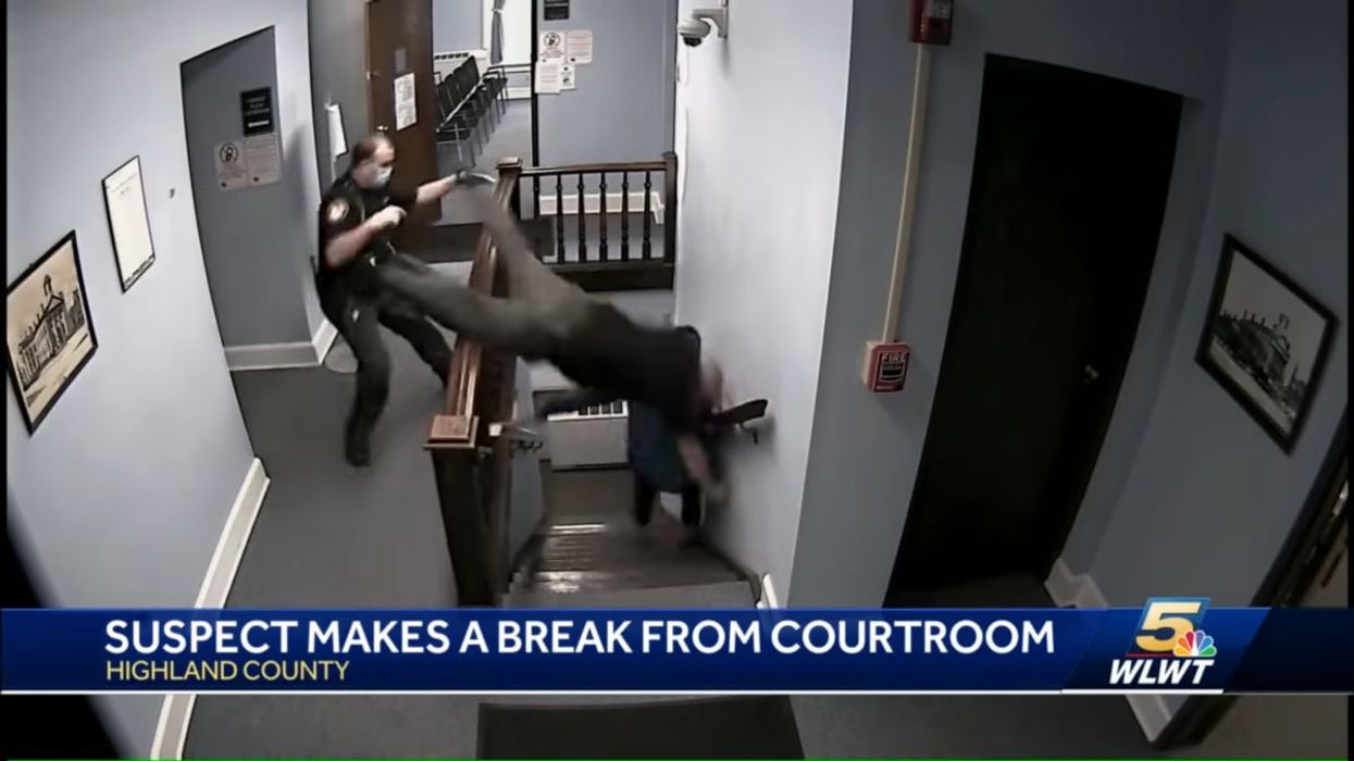 Video: Police officer launches himself headfirst down courthouse stairs in attempt to catch fleeing suspect