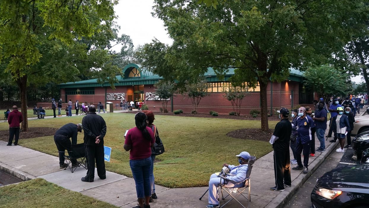 Georgia residents face long lines on first day of early voting. Some voters had to wait 'six hours or more' to cast their ballot.