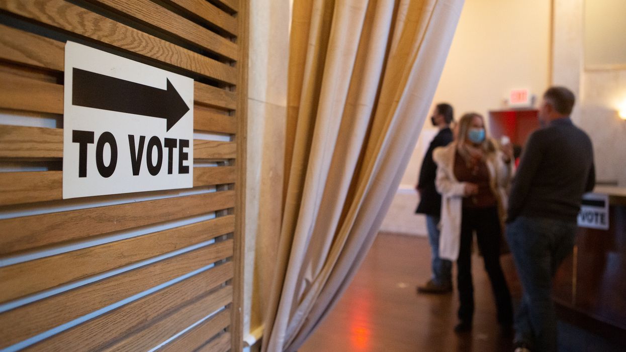 Georgia officials say abnormal company update caused a glitch that halted machine voting for hours in two counties