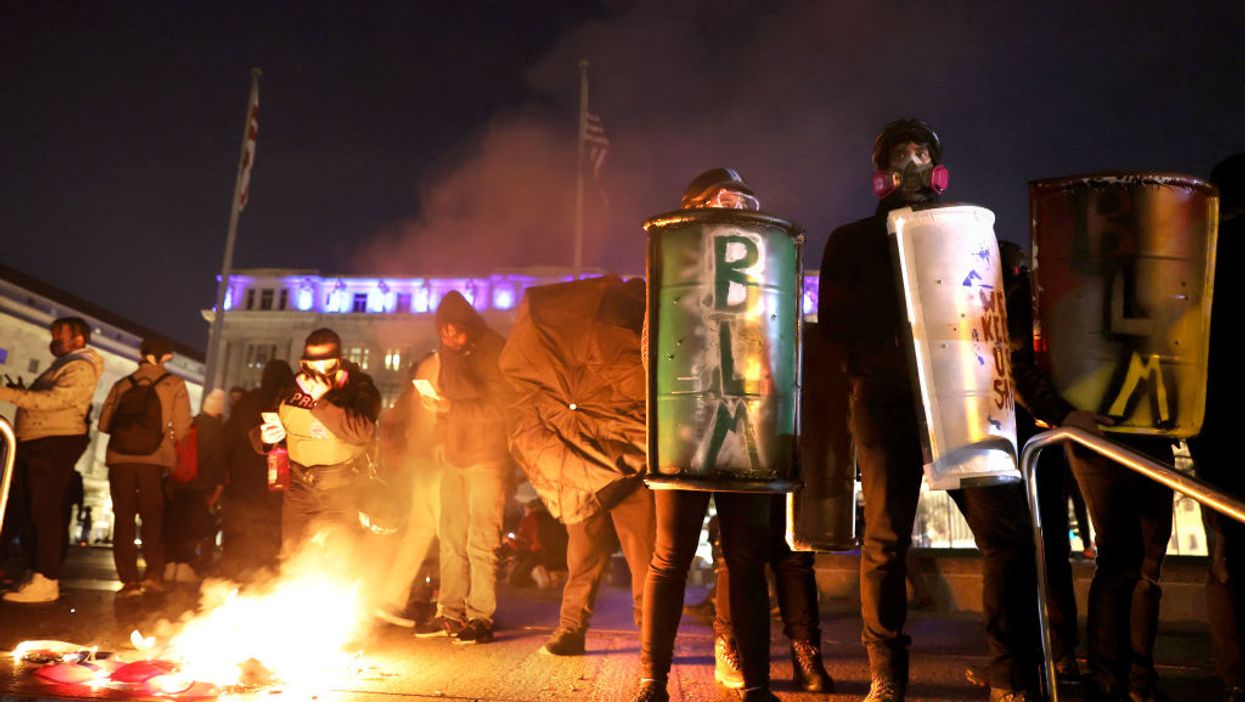 Elderly Trump supporter attacked, protesters shoot fireworks at diners, surround hotel of Million MAGA March attendees