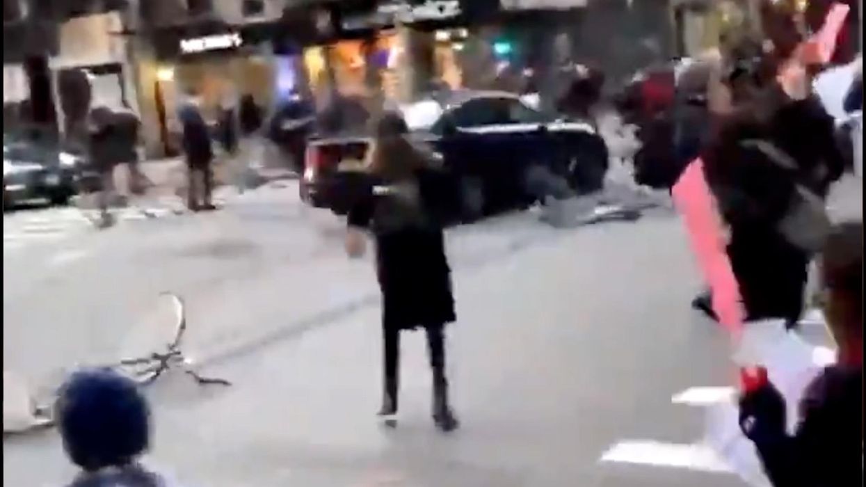 Shocking video shows driver running over protesters after they bang on her car during Manhattan demonstration against ICE