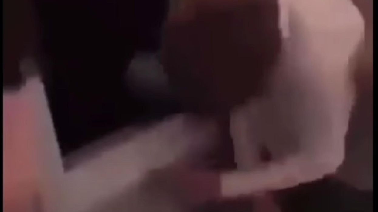 Police investigating viral video showing teenagers laughing as they stomp on a boy and throw him out of a window