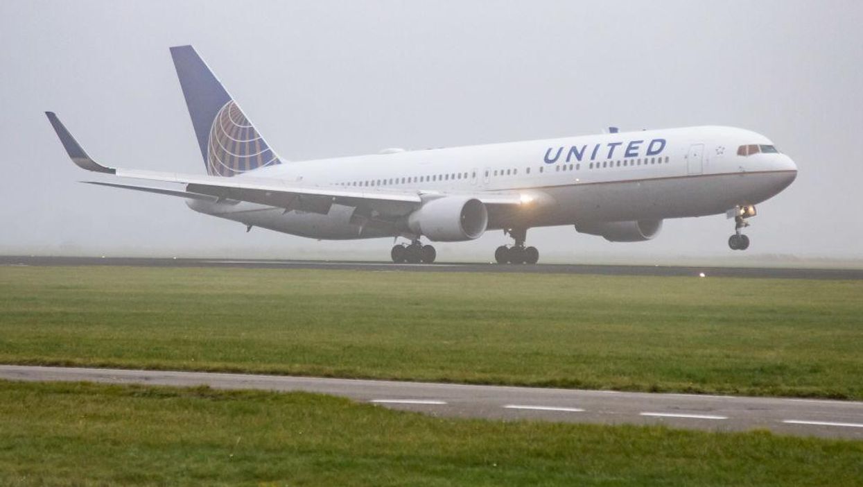 EMT soaked in 'sweat and urine' on flight from performing CPR on possible COVID passenger who died after emergency landing