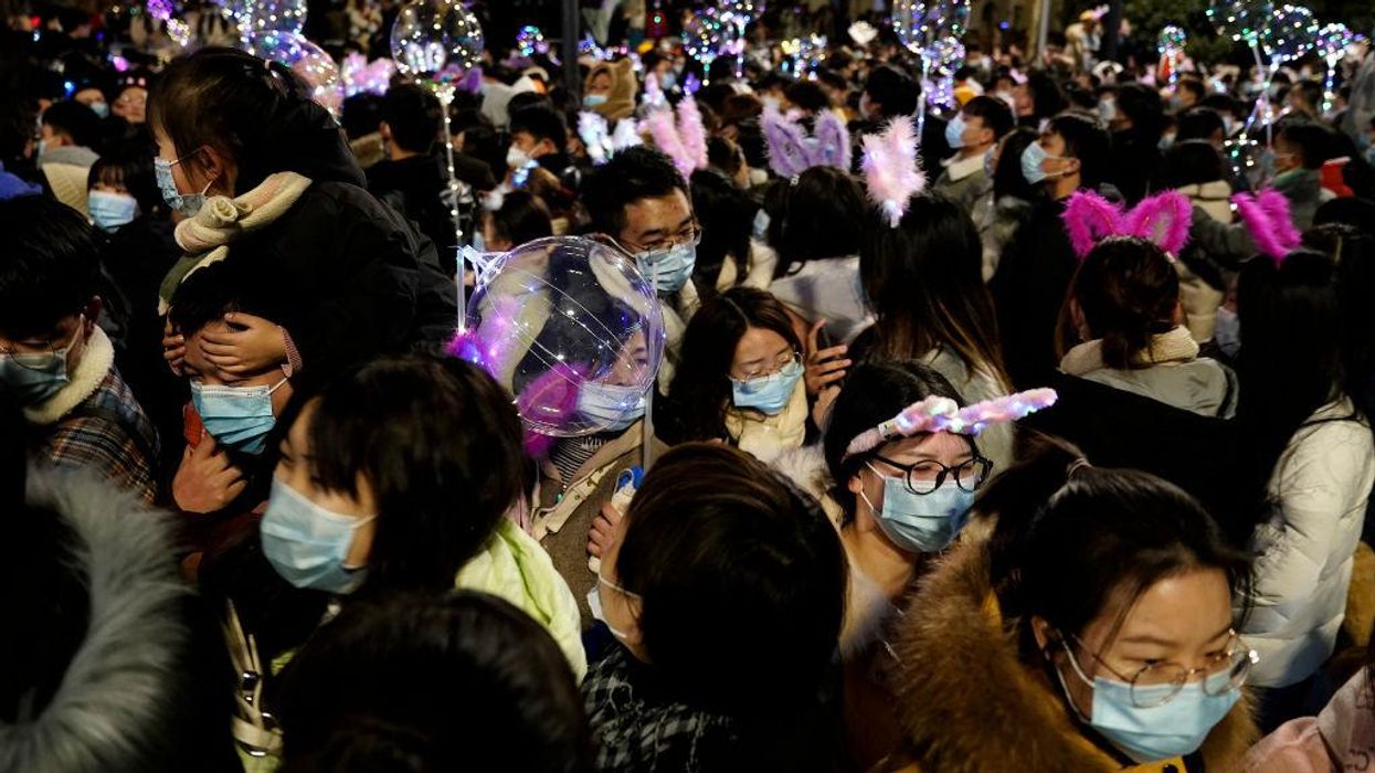 Chinese government allowed thousands to cram the streets of Wuhan for New Year's Eve celebration