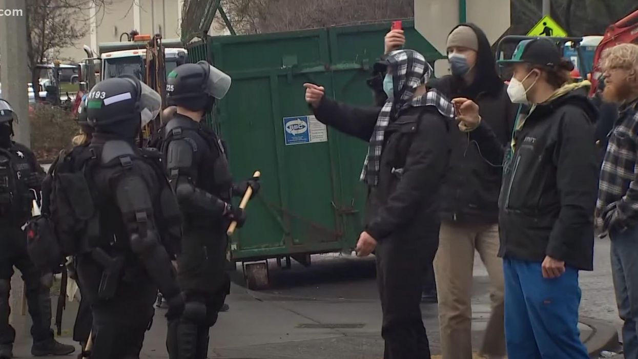 Officials clear out large homeless encampment engulfing town's city hall over fears of violence by 'agitators' from Portland