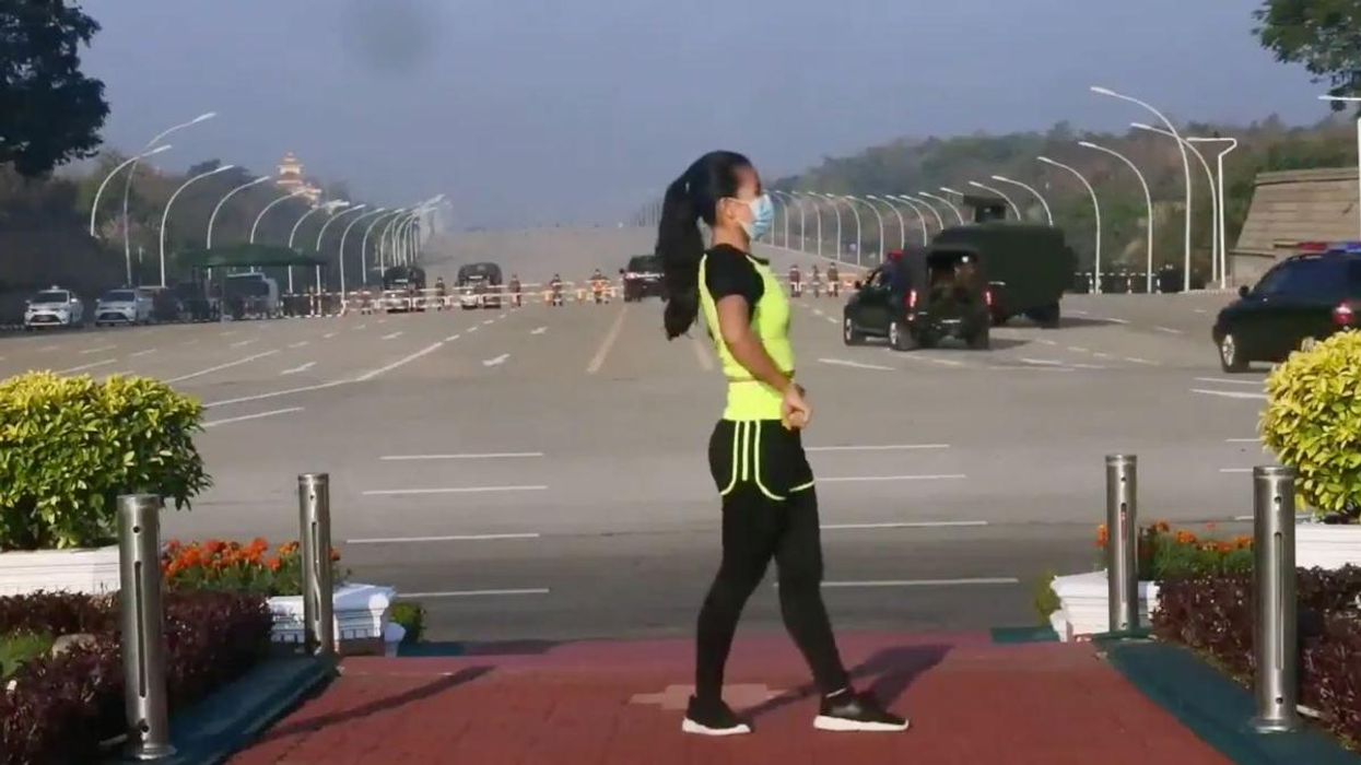 Watch: Woman appears to dance obliviously as Myanmar military instigates coup in background