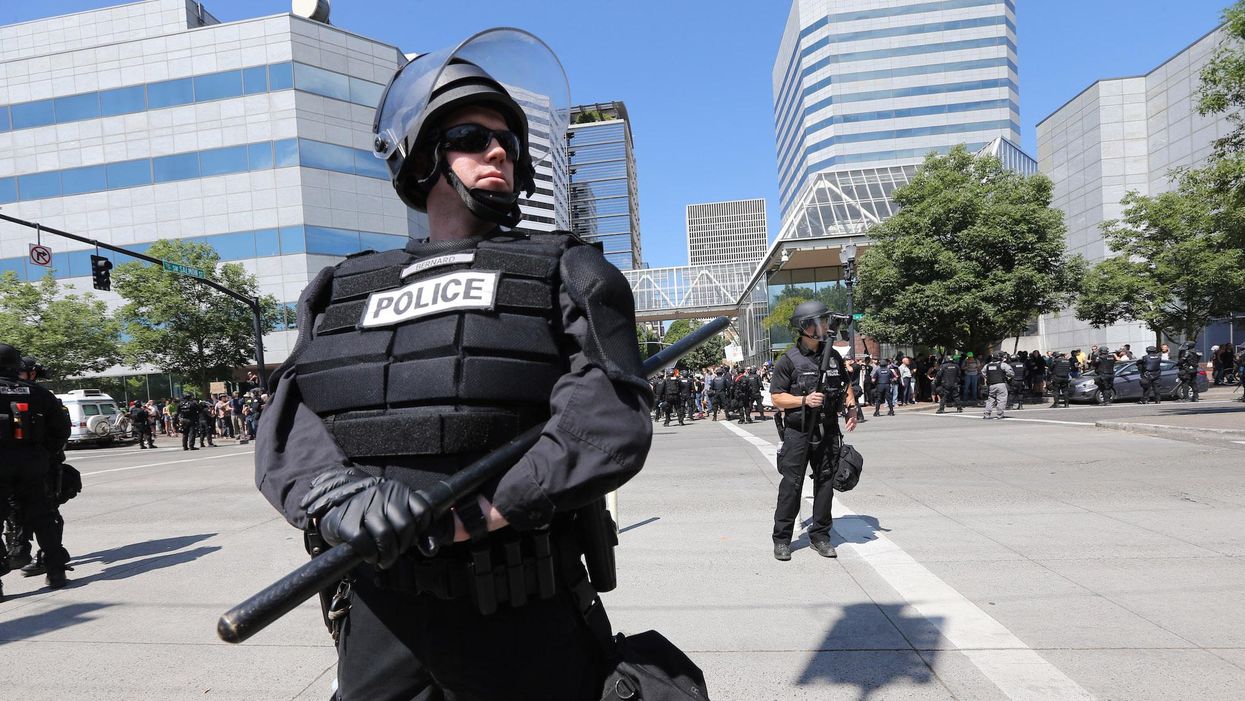 Rioters tried to break down the door to a police association in Portland in broad daylight