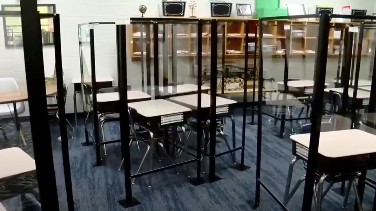 Grade school teacher criticizes 'prison-like' plexiglass cubicles. District tells her to take down FB post and stop being negative.