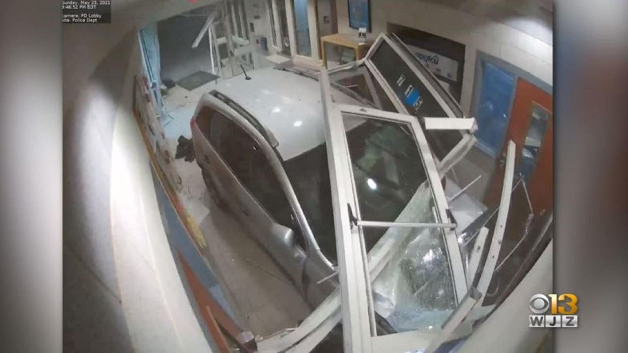 Man accused of 'intentionally' crashing car into police station after threatening to kill an officer