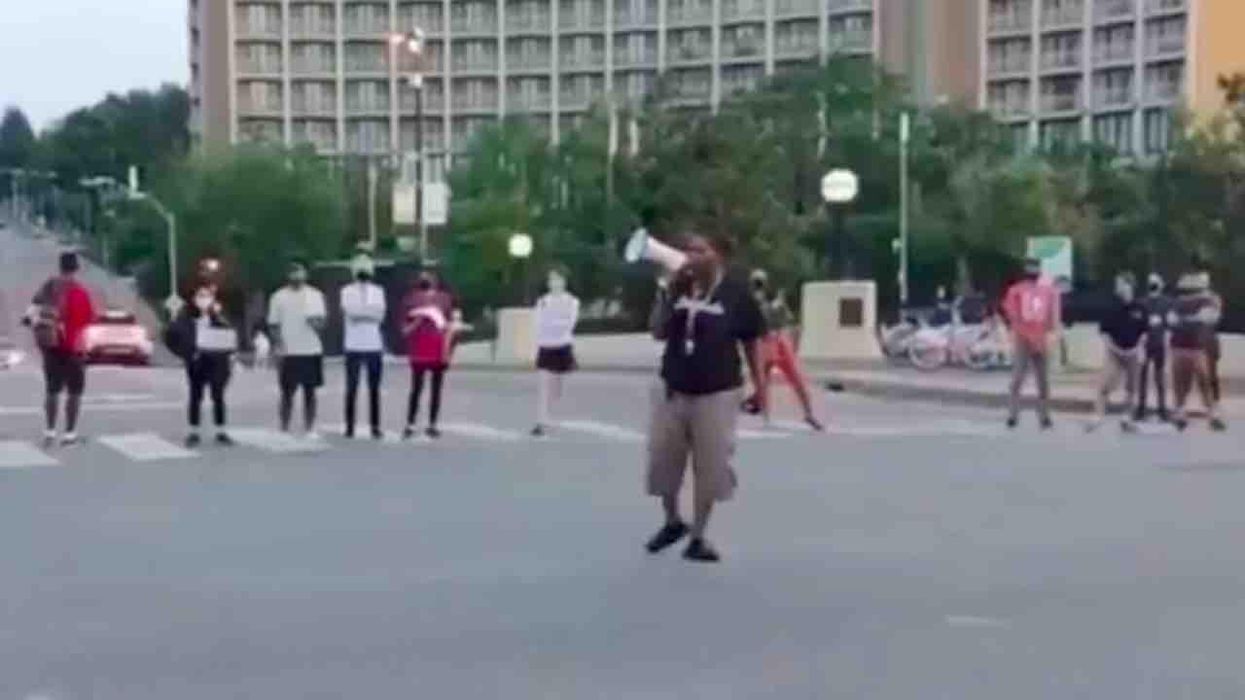 'We're gonna blow your motherf***in' head off': Black Lives Matter protester on bullhorn threatens police