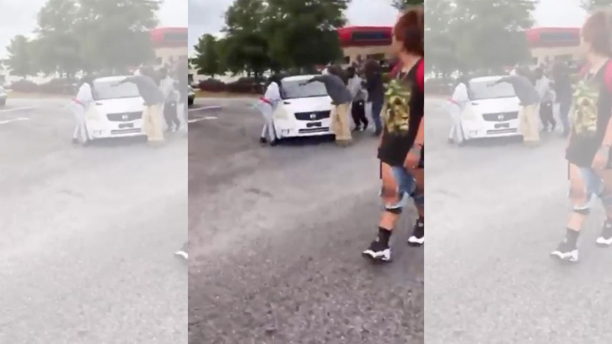 Woman charged with intent to kill after police say she hit protesters blocking road. But here's what the video shows.