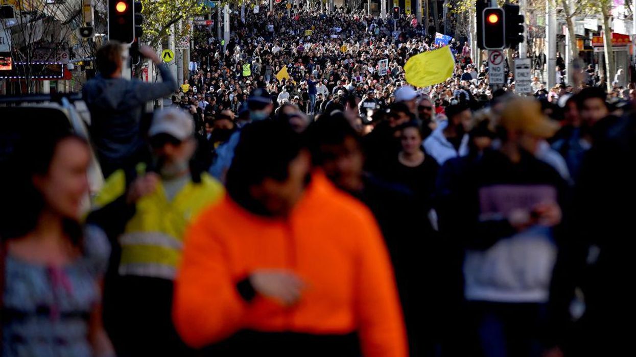 WATCH: Tens of thousands participate in worldwide anti-vaccine passport protests, violent clashes erupt