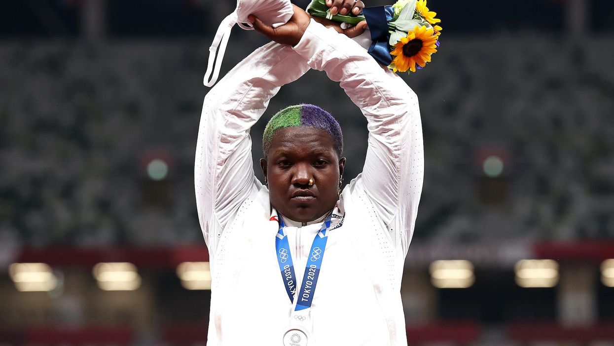 Olympic committee reviews US athlete's gesture supporting 'oppressed' people as a potential violation of protest ban