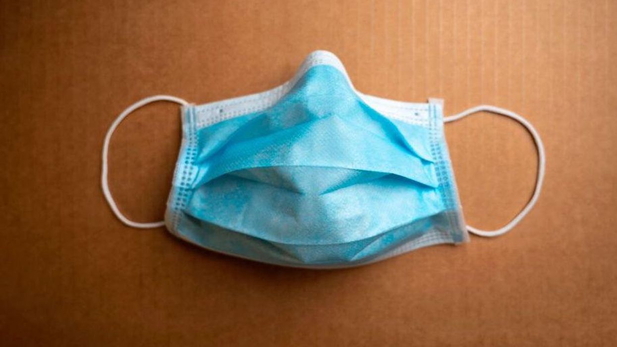 Philadelphia will require city workers to wear two face masks if they are not fully vaccinated