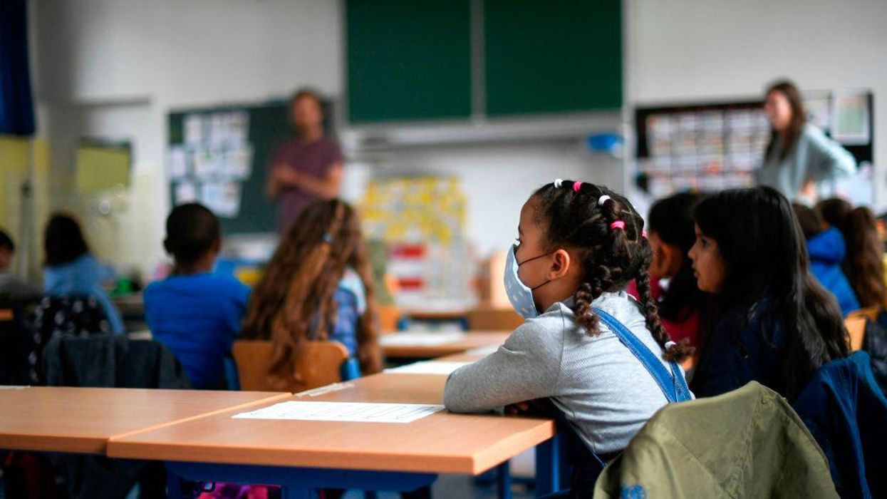 Chiropractor who signed hundreds of mask exemptions for students said he did so because parents 'felt so helpless' that they broke down crying