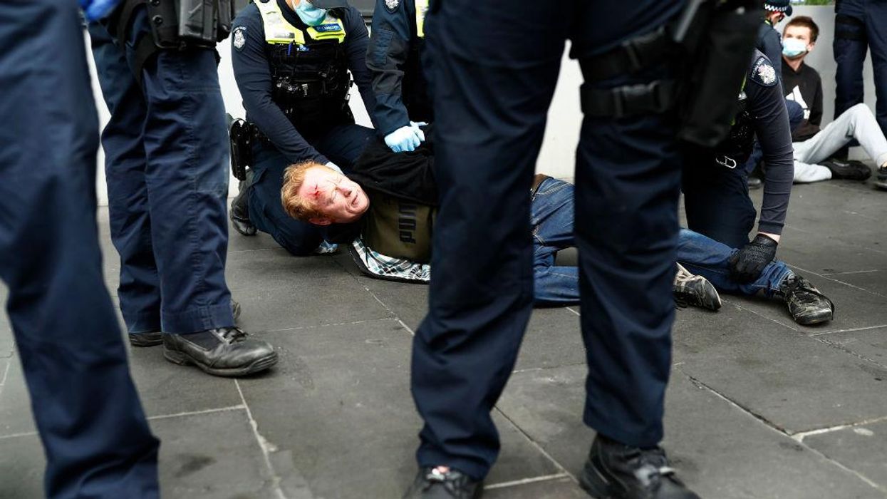 Disturbing videos from Australia show police engaging in brutal violence, going door-to-door asking residents about participating in protests