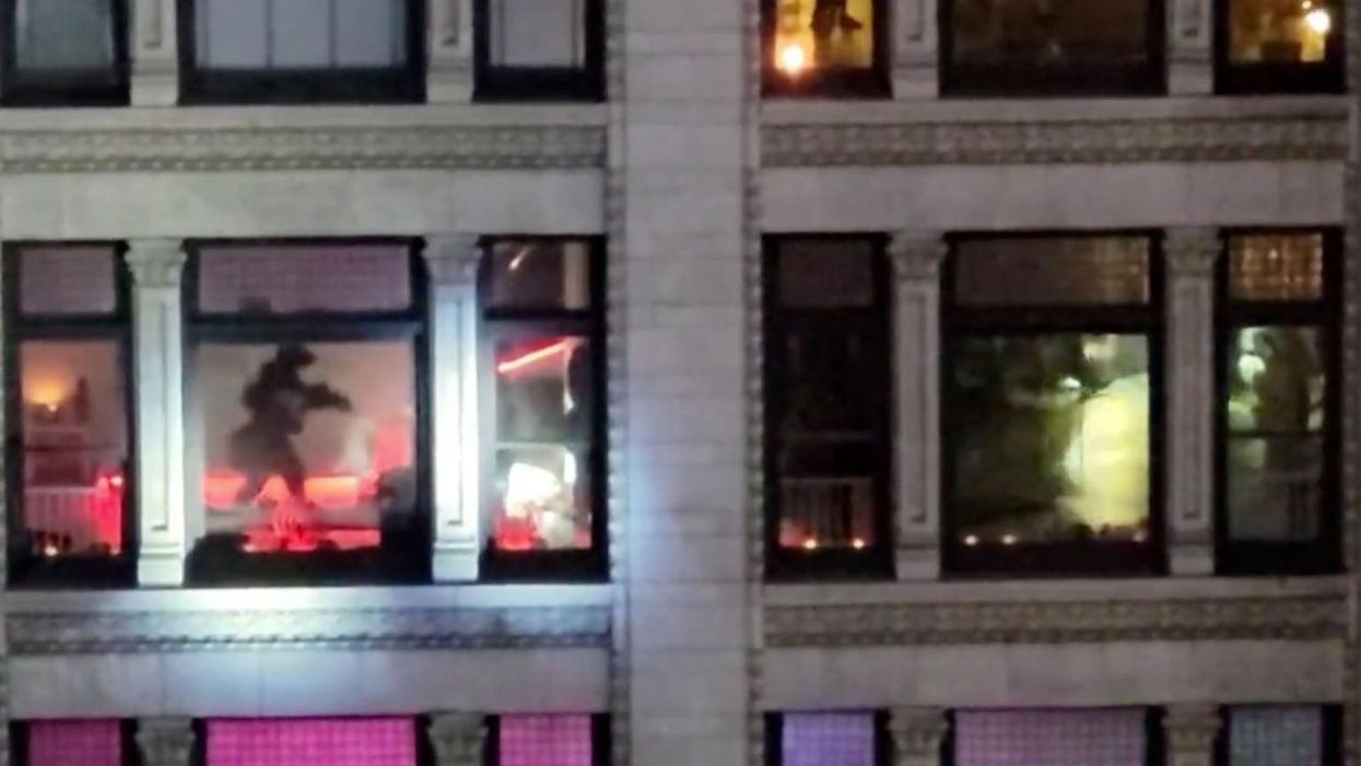 Dramatic video shows hostage situation unfold: SWAT team neutralize armed suspect barricaded in high-rise apartment, save woman