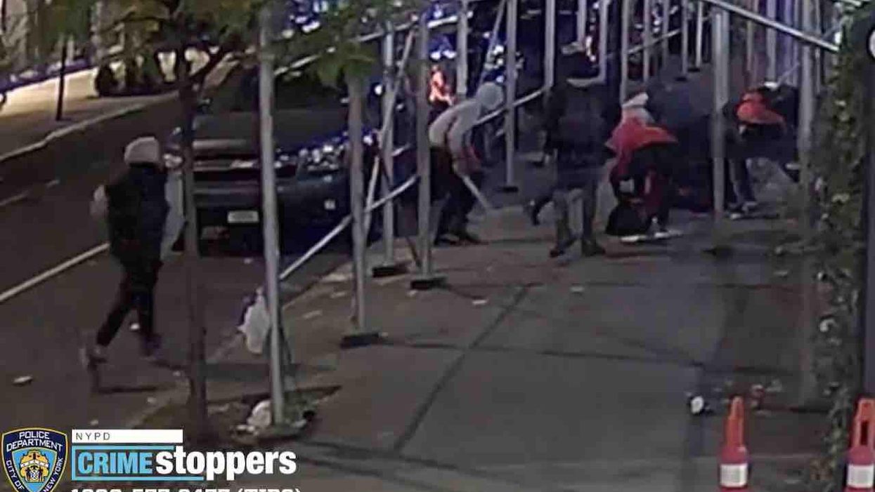 'A pack of animals!': Seven thugs gang up on 62-year-old man, knock him to sidewalk with stick, stab him, slash him — and walk away smiling