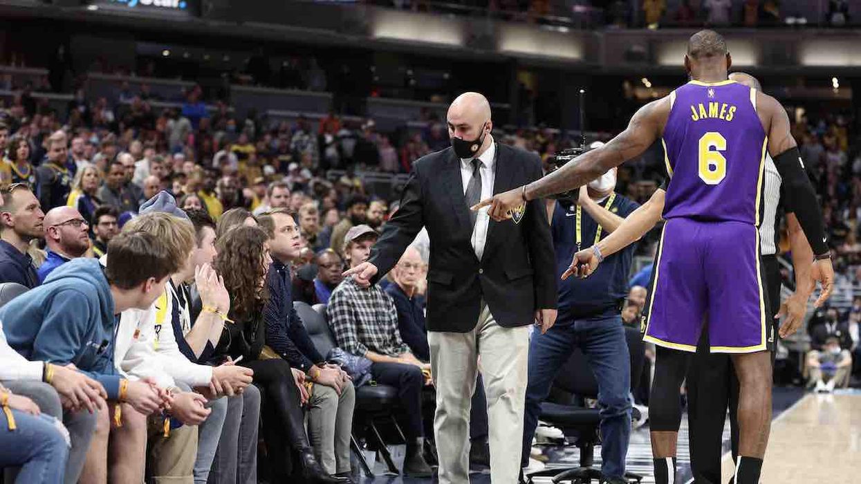LeBron James mocked as 'LeSnitch' and 'LeKaren' after ejecting heckling fans from game and then is fined after making obscene gesture — during same contest