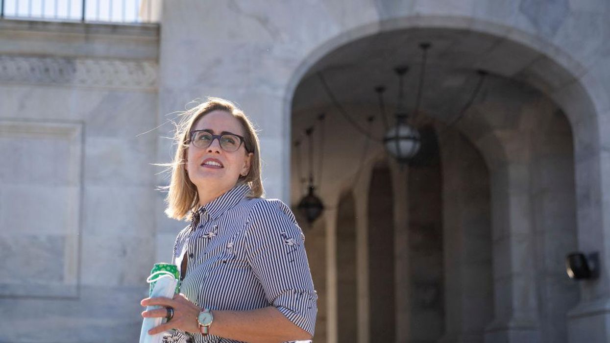 Democratic Sen. Kyrsten Sinema is not committing to vote in favor of Biden's massive spending proposal