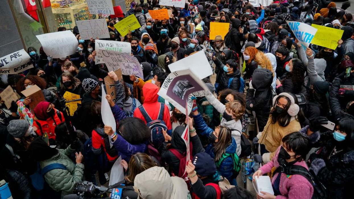 Hundreds of Chicago students orchestrate school walkout and crowded protest to demand safer COVID-19 conditions, relief stipends, and laptops