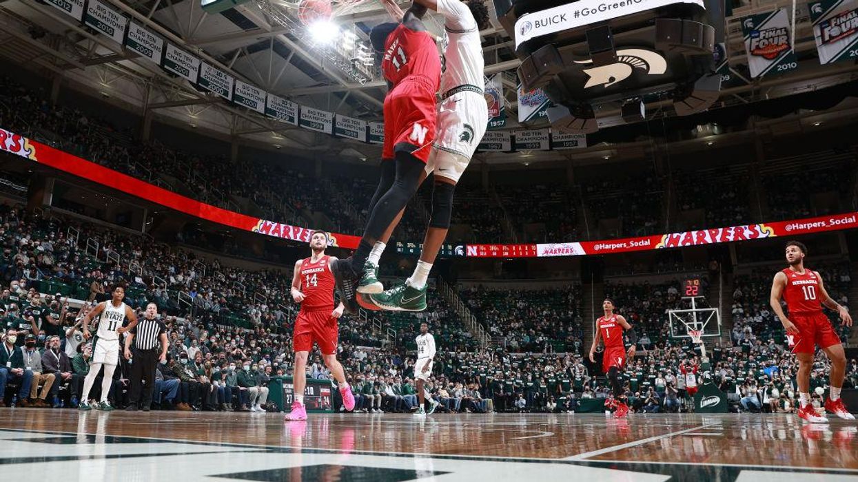 Michigan State University allows nearly 15,000 basketball fans at sold-out games but shuts down in-person learning in January