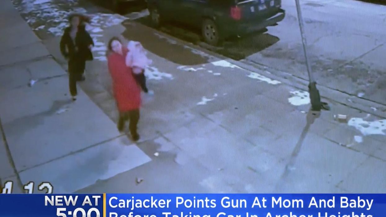 VIDEO: Carjacker points gun at 1-year-old girl, her mother, and third victim in Chicago. After thugs take their vehicle, victims run to safety.
