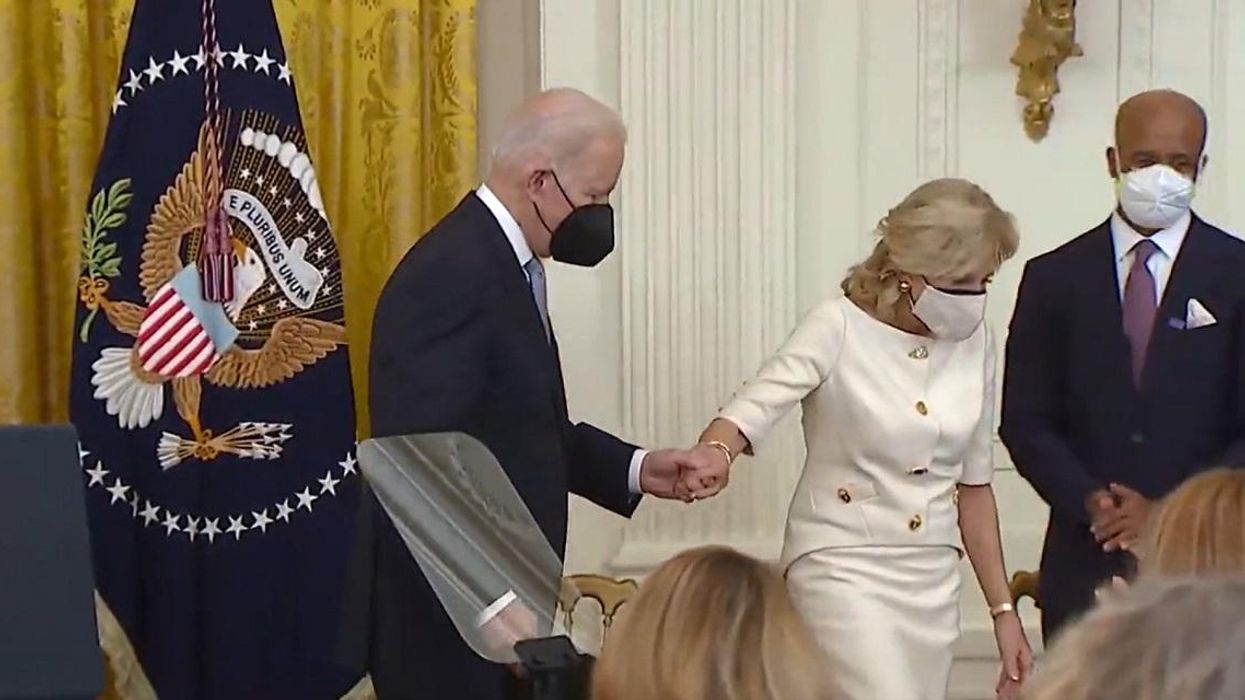 ‘What a f**king embarrassment’: Twitter savages Biden after he wanders from podium, appears to need help getting off stage