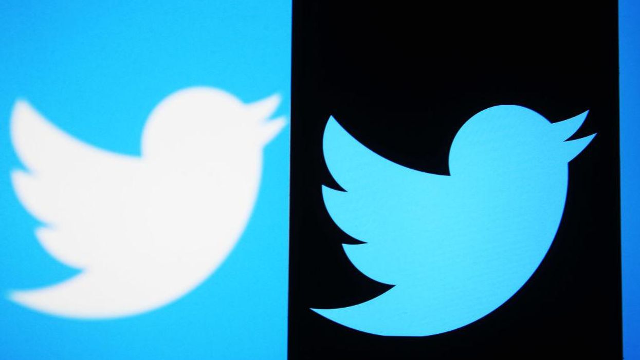 Amid Russian invasion, Ukraine's official Twitter account calls for the social media platform to ban @Russia