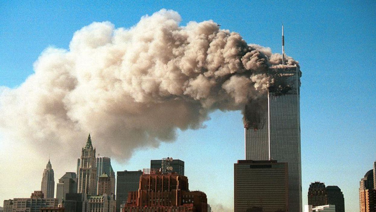 Two NY state Democratic lawmakers apologize for posing with a sign comparing the 9/11 terror attacks to climate change