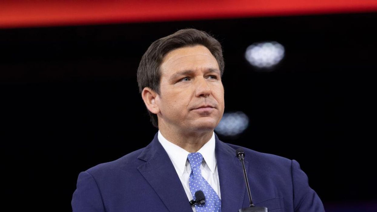 In 'Snow White' reference, WaPo cartoonist depicts Florida Gov. Ron DeSantis holding basket of poisoned apples as the bodies of children lay on the ground