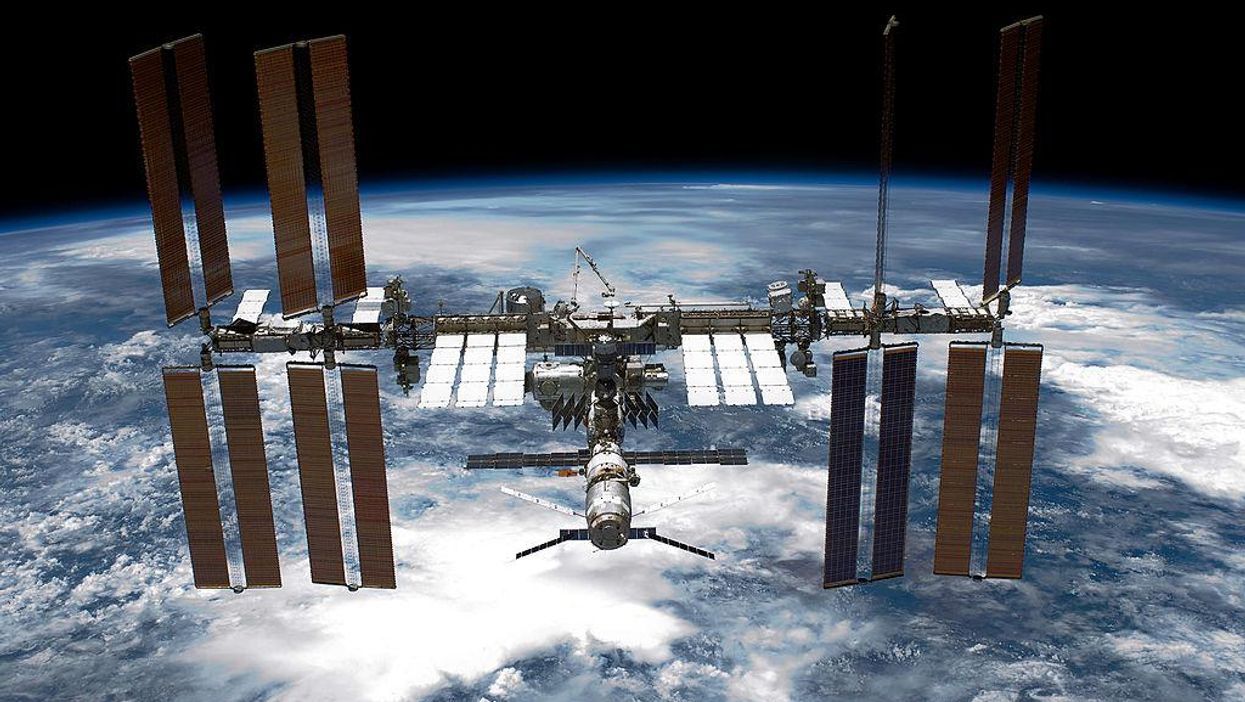 The first all-civilian crew of astronauts has docked with the International Space Station