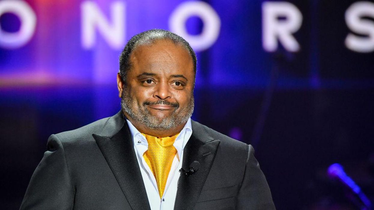 Despite mask mandate ruling Roland Martin declares that he is 'double masked and wearing goggles' for his flight