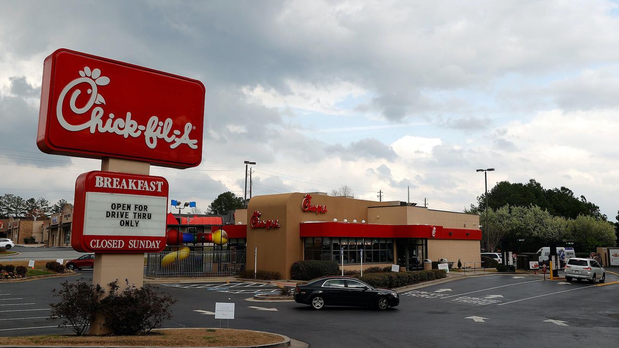 Viral video catches woman leaving car at Chick-fil-A drive-thru when the car begins to roll away towards busy traffic