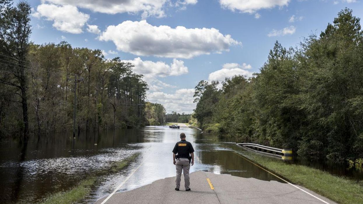 Deputy sentenced to 18 years after detainees get trapped in floodwaters, drown in the back of his police van