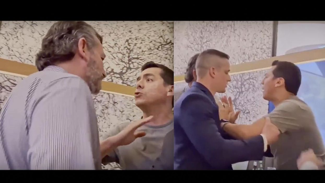 Angry activist gets in Ted Cruz's face at Houston restaurant over guns, gets restrained and dragged out. He smiled in photo with Cruz before ambushing him.