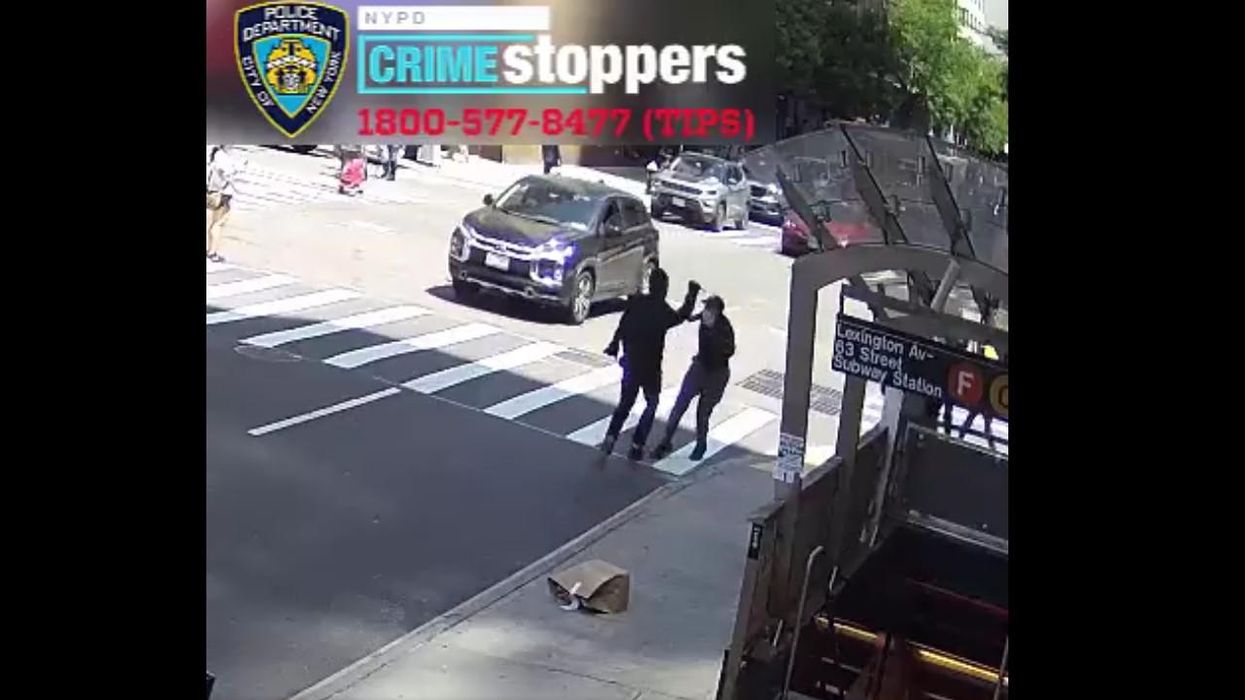 Violent video depicts masked assailant erratically stabbing man in broad daylight