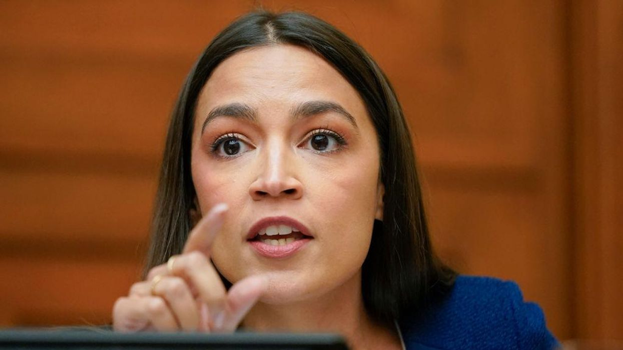 AOC nervously laughs off endorsing Biden in 2024 while 50 'frustrated' Democrats say he should be cut loose and not seek re-election