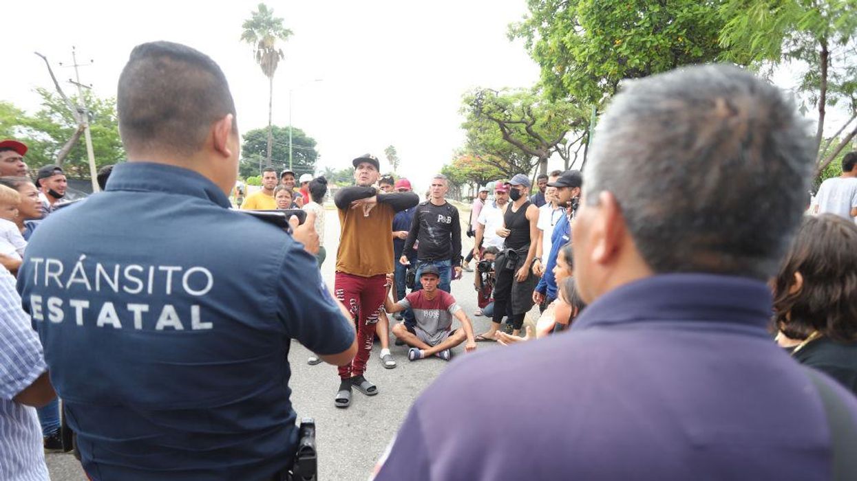 Mexico breaks up massive migrant caravan but gives migrants free pass to travel to US
