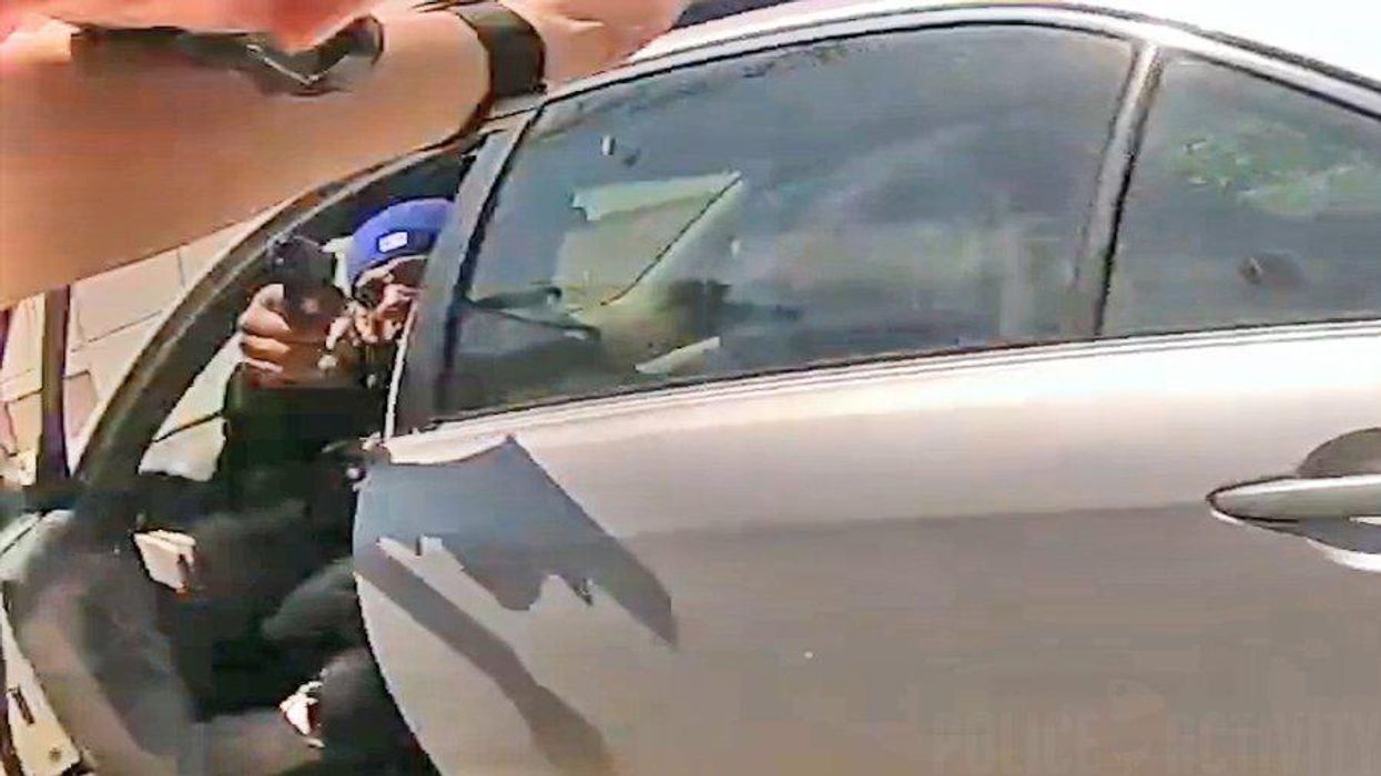 Chilling bodycam video shows the moment crazed driver jumps out of car to shoot Chicago cop, but police prevail in wild shootout