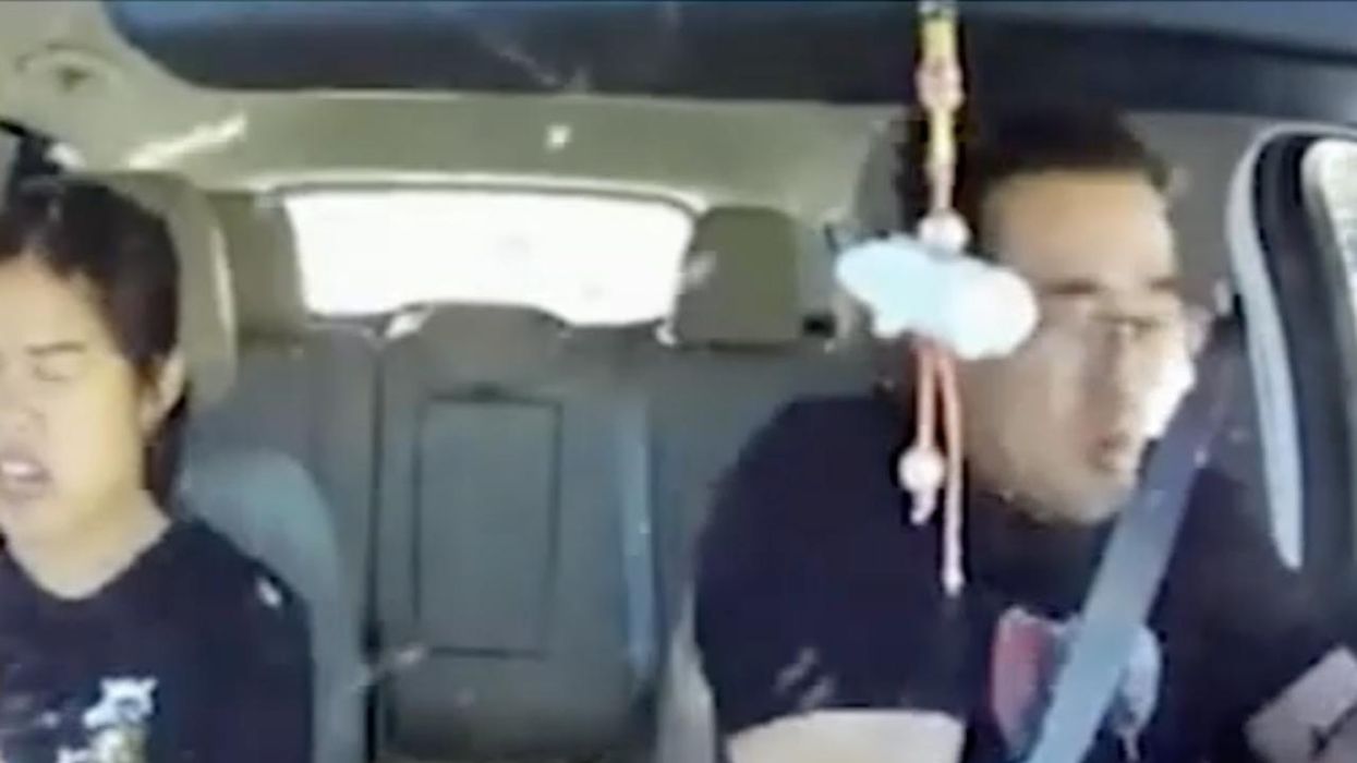 Bullet flies through couple's windshield during freeway shootout, missing them both — and it's all caught on dashcam video